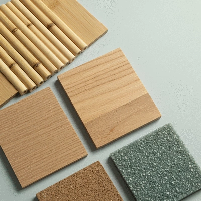 Close-up of various eco-friendly furniture materials like bamboo, reclaimed wood, and recycled plastic swatches, clean image, no text, no words, no typography