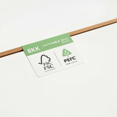 Close-up of a sustainable furniture label with FSC and PEFC certifications, clean image