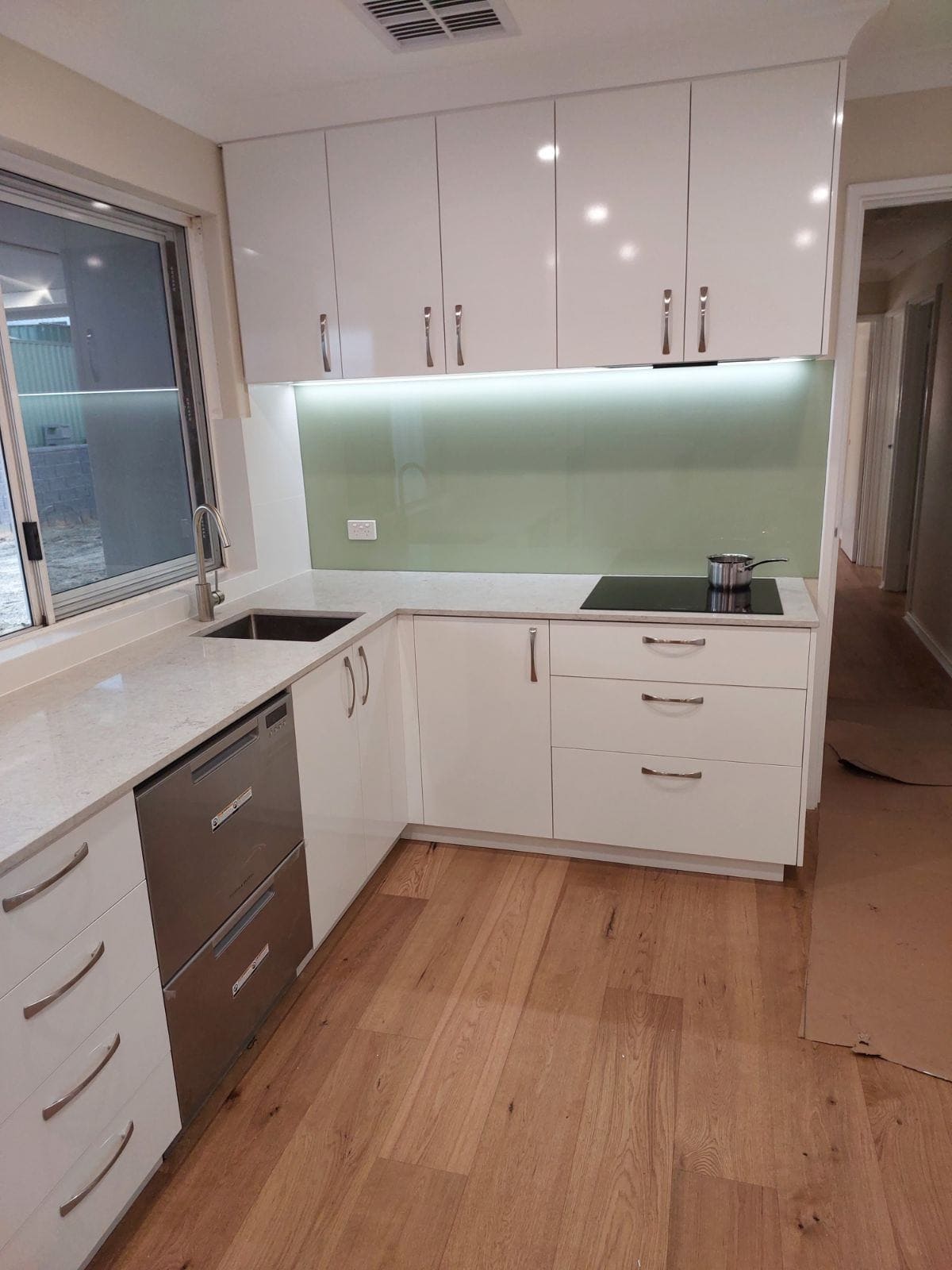 kitchen with pale green splashback