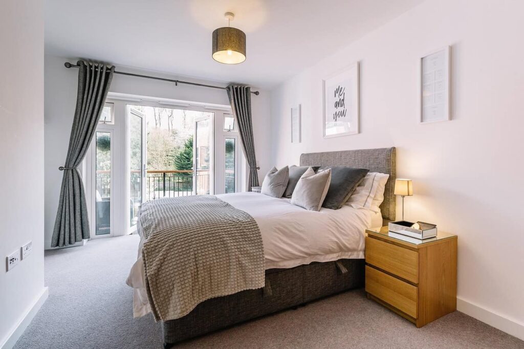 well-organised bedroom featuring a comfy bed